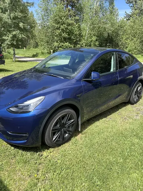 Amazon customer dark Tesla with a glossy outdoor finish