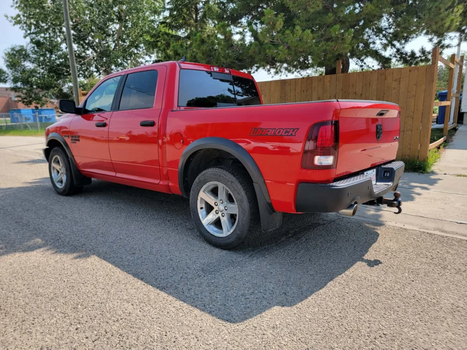 Red pickup truck photographed outdoors in daylight