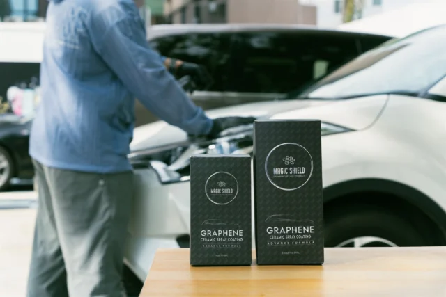Magic Shield Graphene Ceramic Spray Coating 9oz and 16oz sizes beside a real vehicle